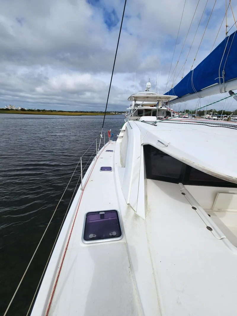 Slide: The Image of Helm station of a 2015 Leopard 44 catamaran docked at a marina. - 40