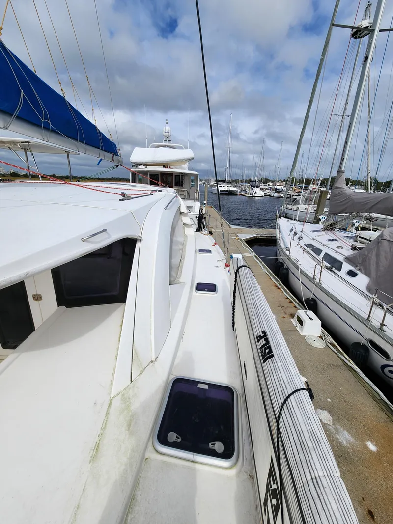 Slide: The Image of Sailing yacht Leopard 44, 2015 model, docked at marina with clear sky background. - 41