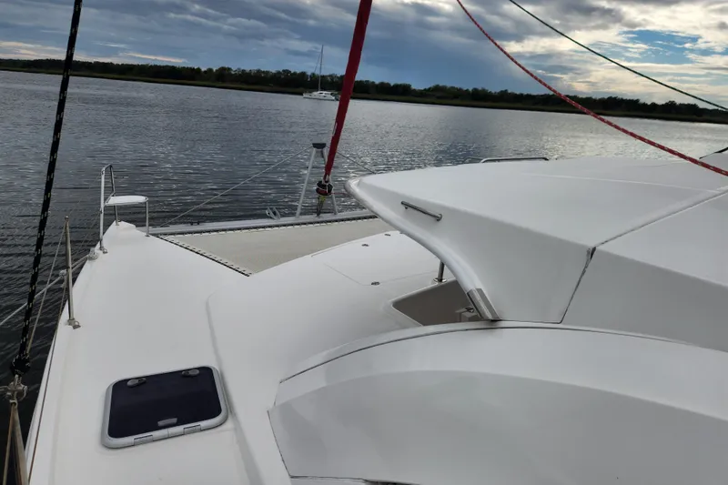 Slide: The Image of 2015 Leopard 44 catamaran on calm water under cloudy sky. - 53