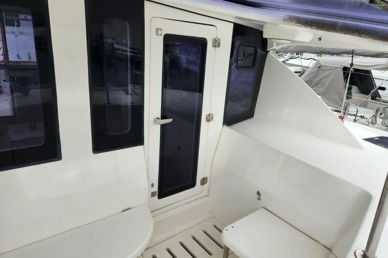Slide: The Image of 2015 Leopard 44 yacht cockpit with seating and door, showcasing sleek design. - 71