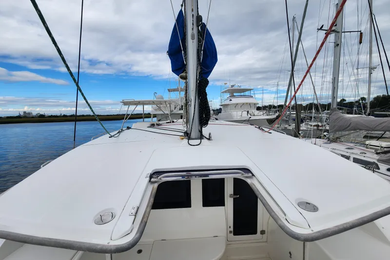Slide: The Image of 2015 Leopard 44 catamaran docked at marina under cloudy sky. - 78
