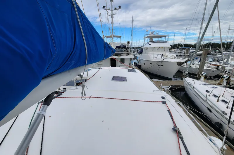 Slide: The Image of 2015 Leopard 44 catamaran docked at marina, surrounded by other boats. - 82