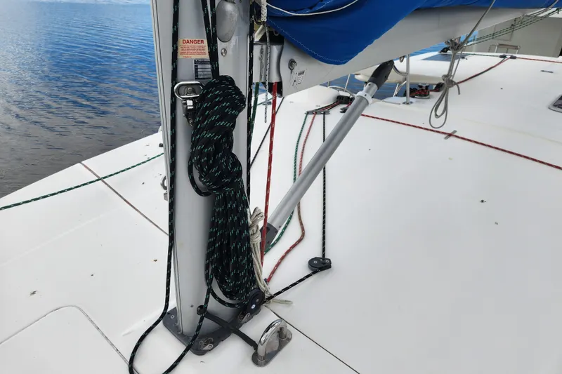 Slide: The Image of 2015 Leopard 44 sailboat deck with rigging and ropes by the water. - 86