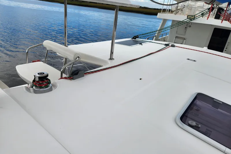Slide: The Image of 2015 Leopard 44 catamaran deck with winch and ropes by the water. - 88