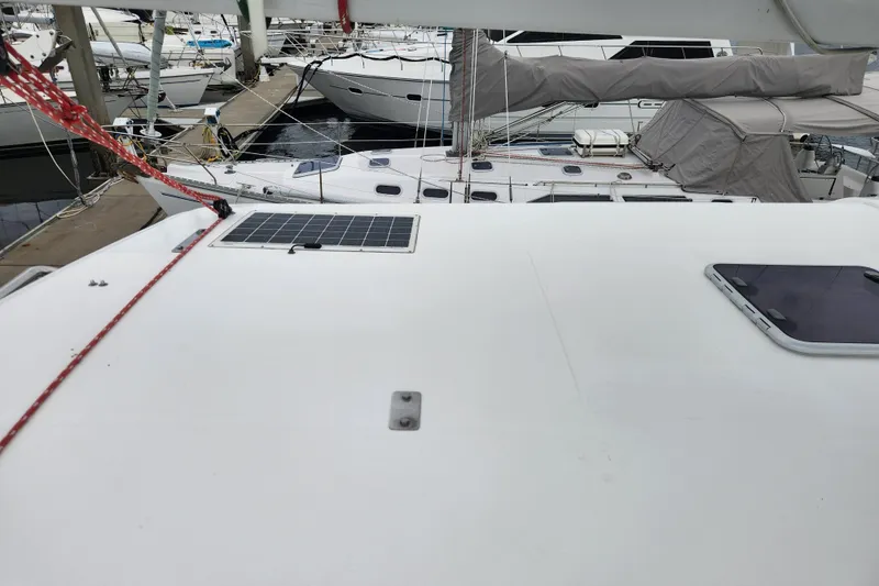 Slide: The Image of 2015 Leopard 44 catamaran docked, featuring solar panel on deck. - 91
