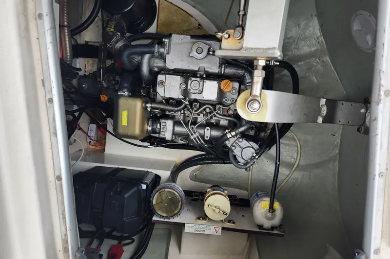Slide: The Image of Engine compartment of a 2015 Leopard 44 catamaran, showcasing mechanical components and wiring. - 93
