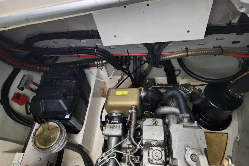 Slide: The Image of Engine compartment of a 2015 Leopard 44 yacht, showcasing mechanical components and wiring. - 95