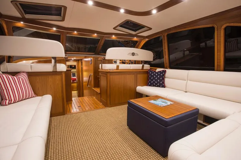 Slide: The Image of Luxurious interior of 2026 Palm Beach Motor Yachts PB52 with elegant seating and wood finishes. - 10