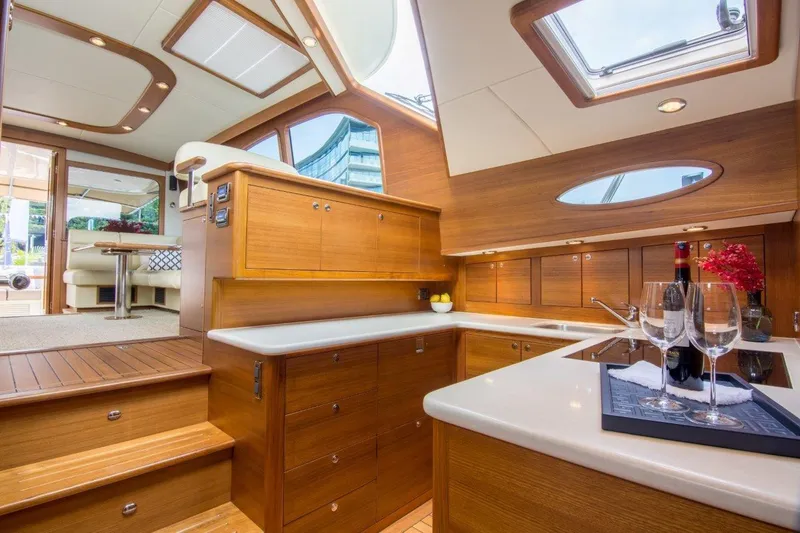 Slide: The Image of Luxurious interior of 2026 Palm Beach Motor Yachts PB52, featuring elegant wood finishes and modern amenities. - 17