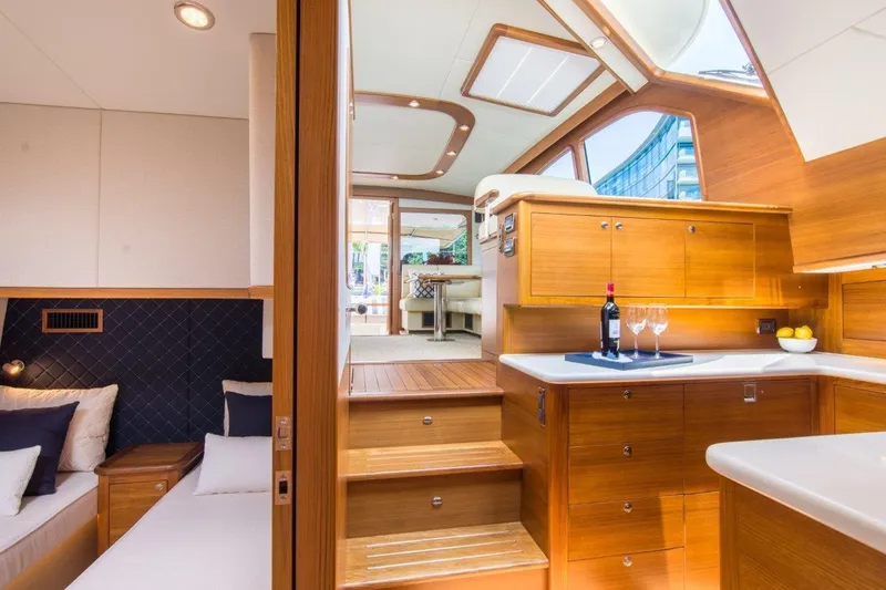 Slide: The Image of Luxurious interior of 2026 Palm Beach Motor Yachts PB52, featuring elegant wood finishes and modern design. - 20