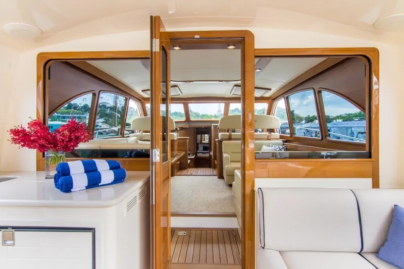 Slide: The Image of Luxurious interior of 2026 Palm Beach Motor Yachts PB52, featuring elegant wood finishes. - 8