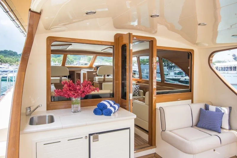 Slide: The Image of Luxurious 2026 Palm Beach Motor Yachts PB52 interior with elegant seating and modern amenities. - 9