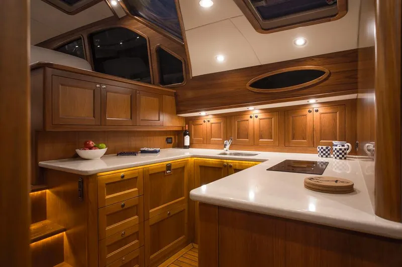 Slide: The Image of Luxurious kitchen interior of 2026 Palm Beach Motor Yachts PB52, featuring elegant wood cabinetry. - 14