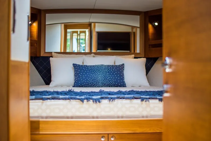Slide: The Image of Luxurious cabin interior of 2026 Palm Beach Motor Yachts PB52 with elegant bedding. - 19