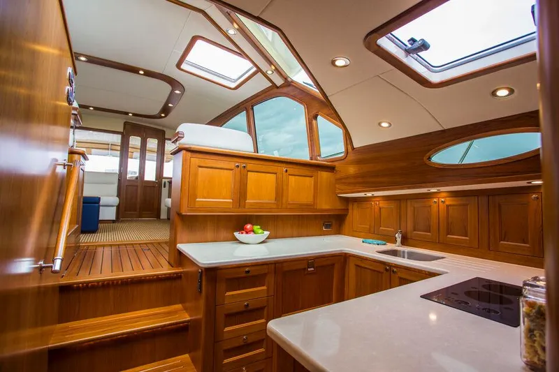 Slide: The Image of Luxurious interior of 2026 Palm Beach Motor Yachts PB52 with elegant wood finish and modern amenities. - 3