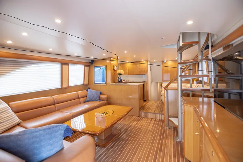 Slide: The Image of Luxurious interior of 2003 Viking 65 Convertible Enclosed Bridge yacht with modern furnishings. - 11