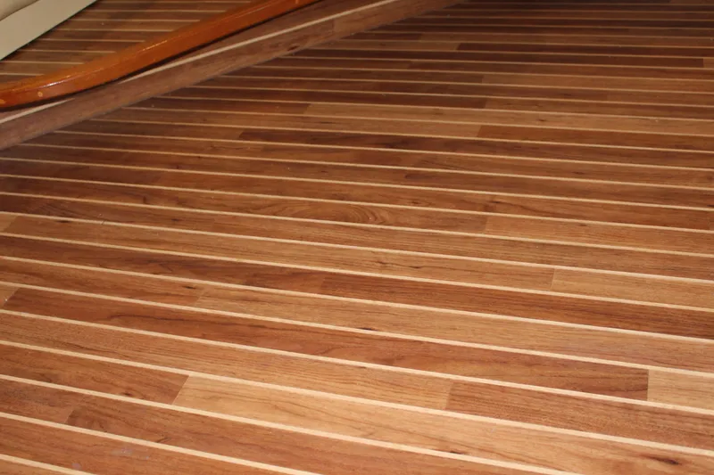 Slide: The Image of Teak wood flooring on 2003 Viking 65 Convertible Enclosed Bridge yacht. - 14