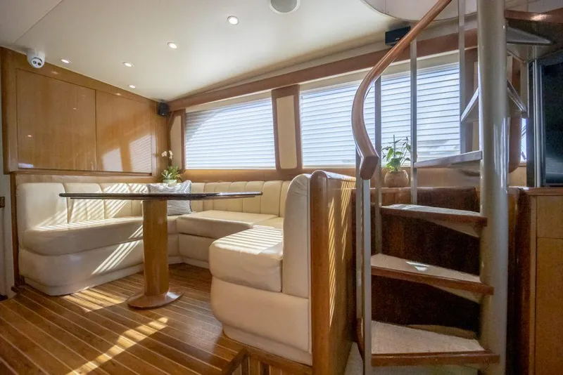 Slide: The Image of Luxurious interior of 2003 Viking 65 Convertible Enclosed Bridge yacht with spiral staircase. - 15