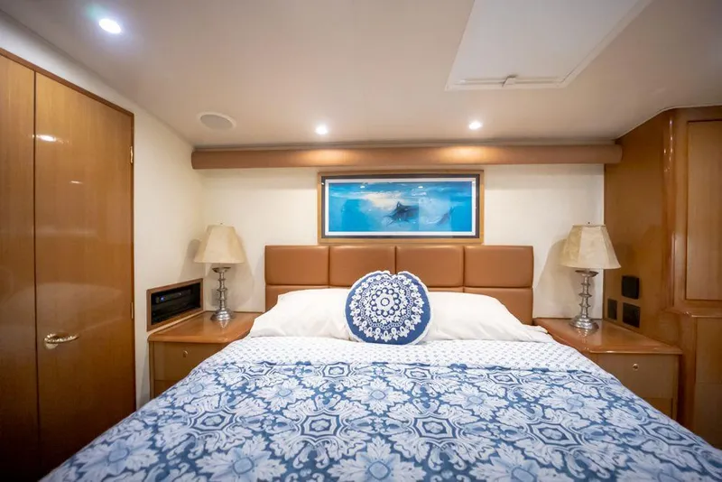 Slide: The Image of Luxurious bedroom interior of 2003 Viking 65 Convertible Enclosed Bridge yacht. - 28