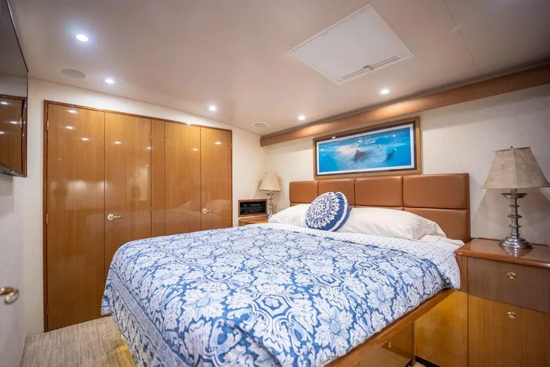 Slide: The Image of Luxurious bedroom interior of 2003 Viking 65 Convertible Enclosed Bridge yacht. - 29