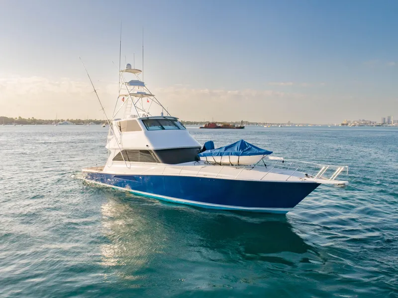 Slide: The Image of 2003 Viking 65 Convertible Enclosed Bridge yacht on open water. - 3