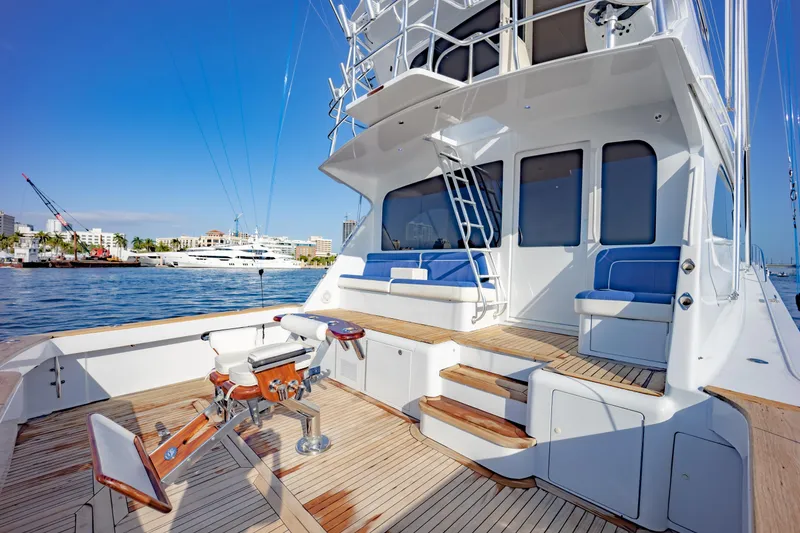 Slide: The Image of 2003 Viking 65 Convertible Enclosed Bridge yacht with spacious deck and seating area. - 45