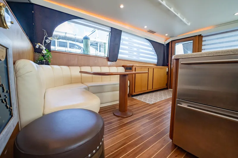 Slide: The Image of Interior of 2000 Viking 50 Conv Sport Fisher yacht with elegant seating and wood flooring. - 17
