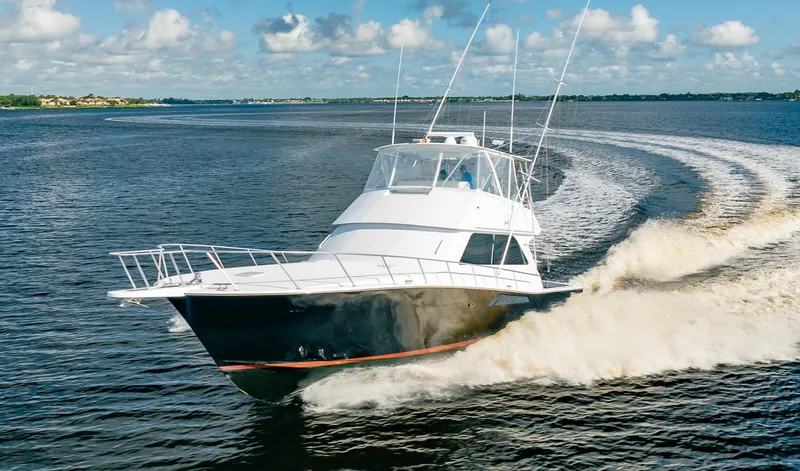 Slide: The Image of Viking 50 Conv Sport Fisher 2000 cruising on open water, creating a dynamic wake. - 35