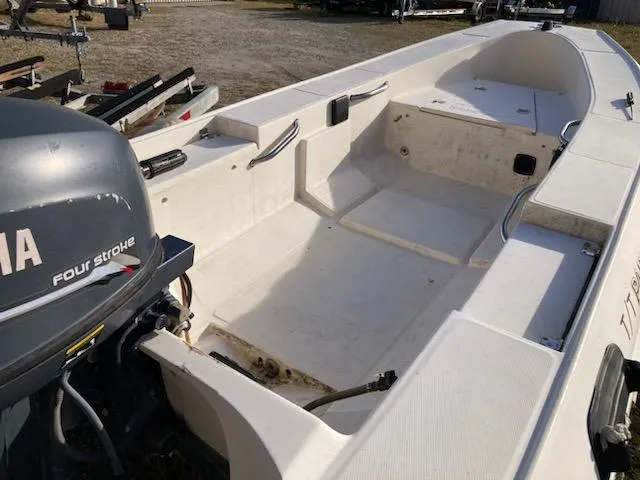 Slide: The Image of 1998 Jouet 13 boat with Yamaha four-stroke engine, spacious interior, and clean design. - 2