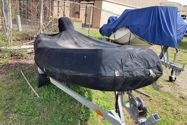 Slide: The Image of Covered Jouet 13 boat on trailer, 1998 model, parked outdoors. - 8