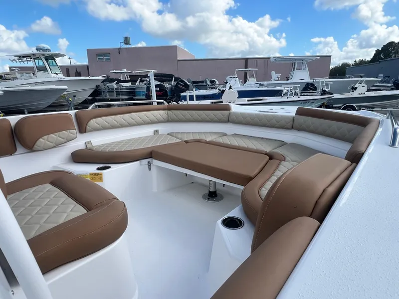 Slide: The Image of 2025 NauticStar 231 Hybrid boat with spacious seating and modern design. - 3