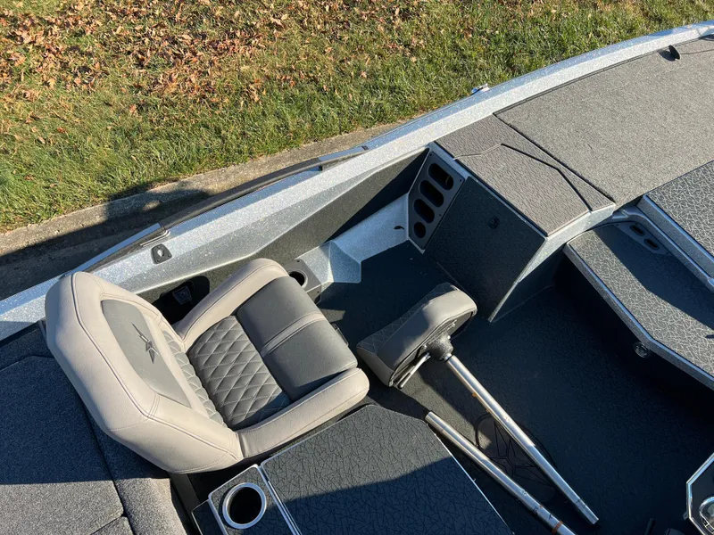 Slide: The Image of 2024 Vexus VXS20 boat interior with gray seating and storage compartments. - 12