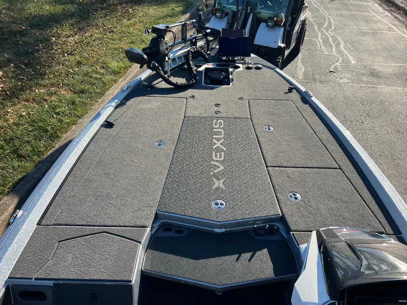 Slide: The Image of 2024 Vexus VXS20 boat deck with advanced fishing equipment and storage compartments. - 13