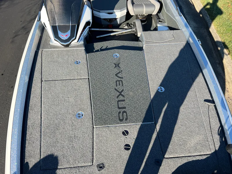 Slide: The Image of 2024 Vexus VXS20 boat deck with storage compartments and seating. - 18