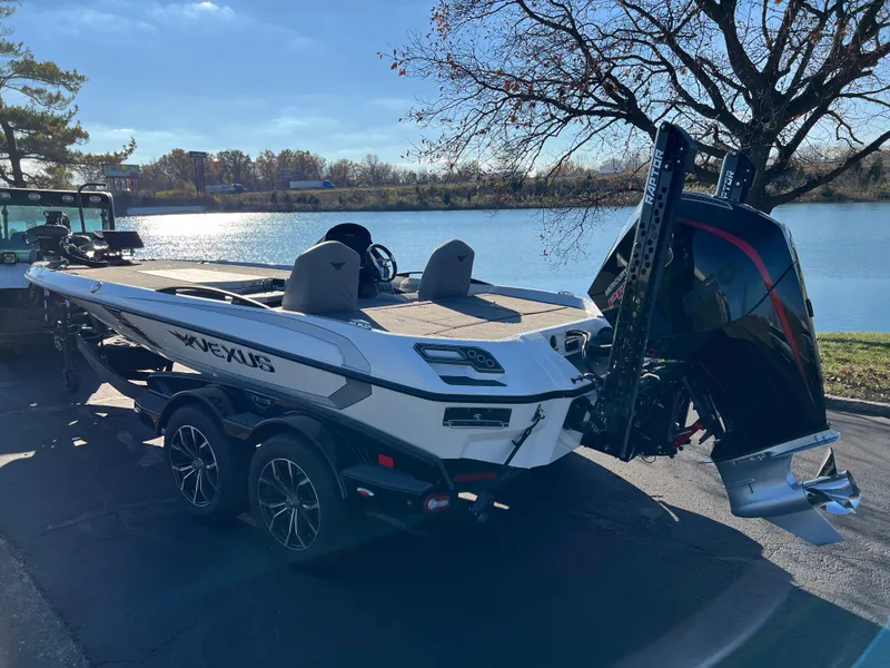 Slide: The Image of 2024 Vexus VXS20 boat by a lake, featuring sleek design and powerful engine. - 3