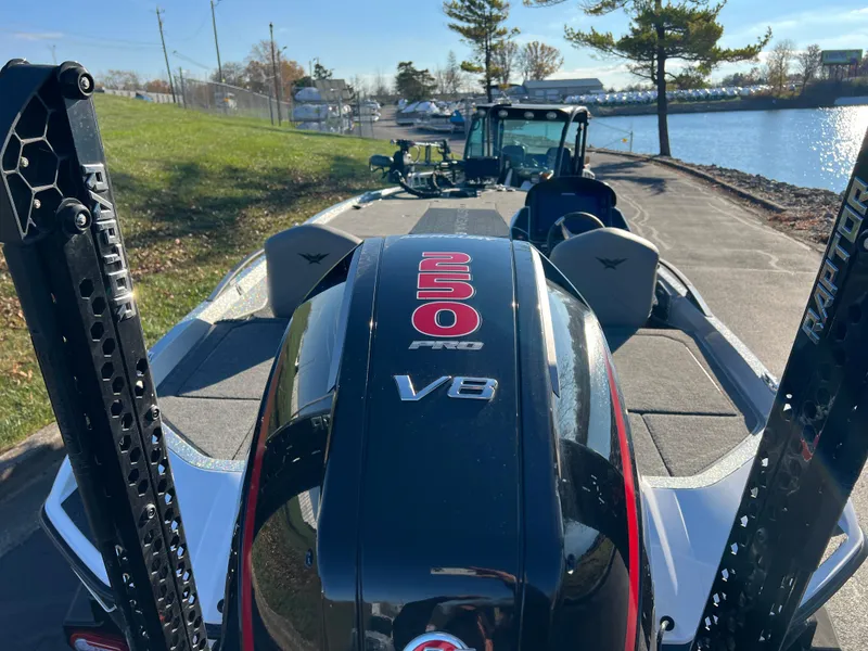 Slide: The Image of 2024 Vexus VXS20 boat with powerful 250 V8 engine by the water. - 4