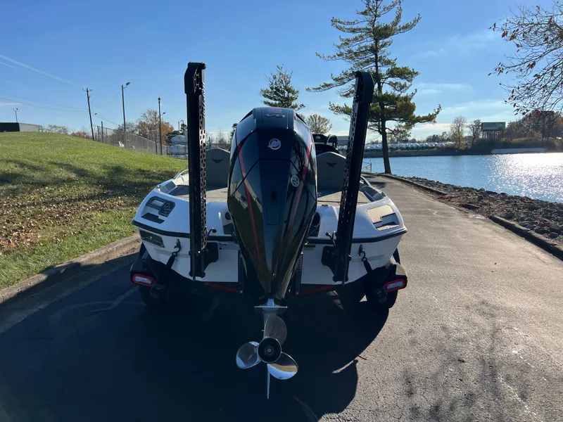 Slide: The Image of 2024 Vexus VXS20 boat parked by a lakeside on a sunny day. - 5