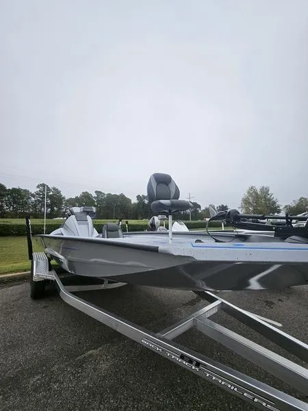 Slide: The Image of 2025 Xpress H20 Bass boat interior with dual seats and steering console. - 12