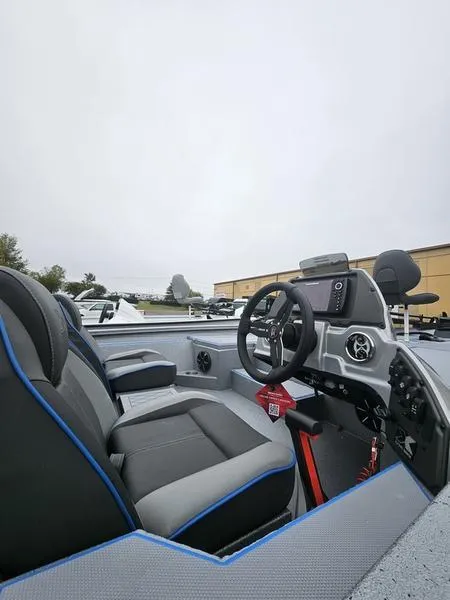 Slide: The Image of 2025 Xpress H20 Bass boat storage compartments with open lids, showcasing interior space. - 4