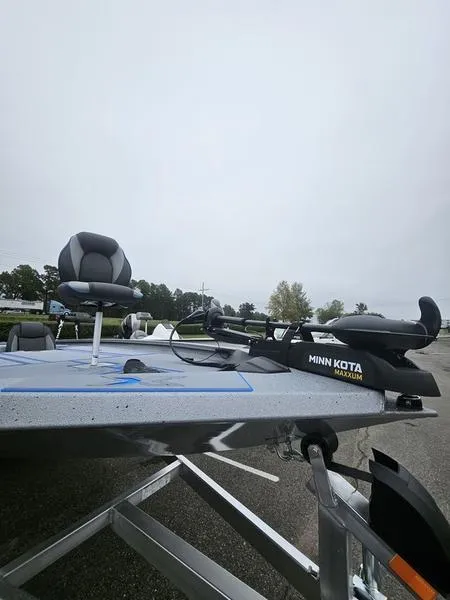 Slide: The Image of Trailer hitch of 2025 Xpress H20 Bass boat on a concrete floor. - 7