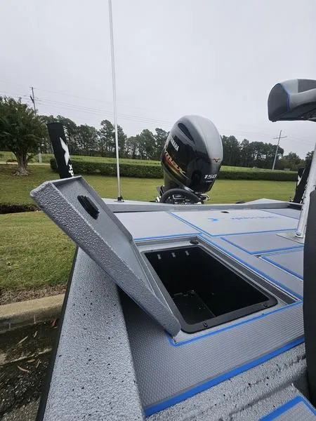 Slide: The Image of 2025 Xpress H20 Bass boat interior with seating and steering console. - 8