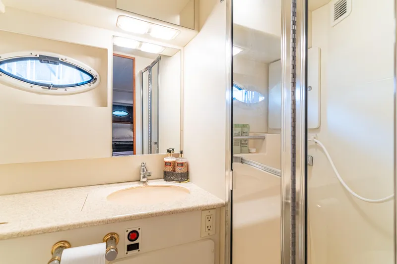 Slide: The Image of Luxurious bathroom in 2001 Silverton 392 Motor Yacht with shower and vanity. - 23