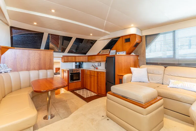 Slide: The Image of Luxurious interior of 2001 Silverton 392 Motor Yacht with modern kitchen and seating area. - 27