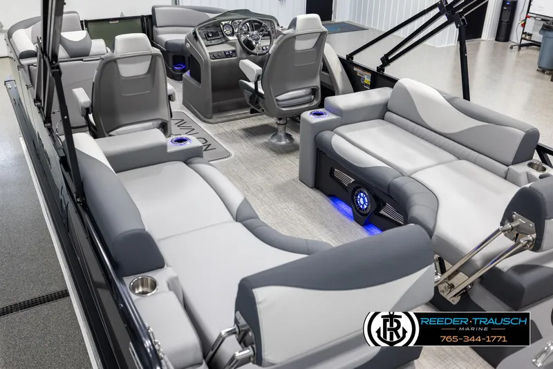 Slide: The Image of Luxurious 2025 Avalon LSZ QLS pontoon boat interior with plush seating and modern dashboard. - 11