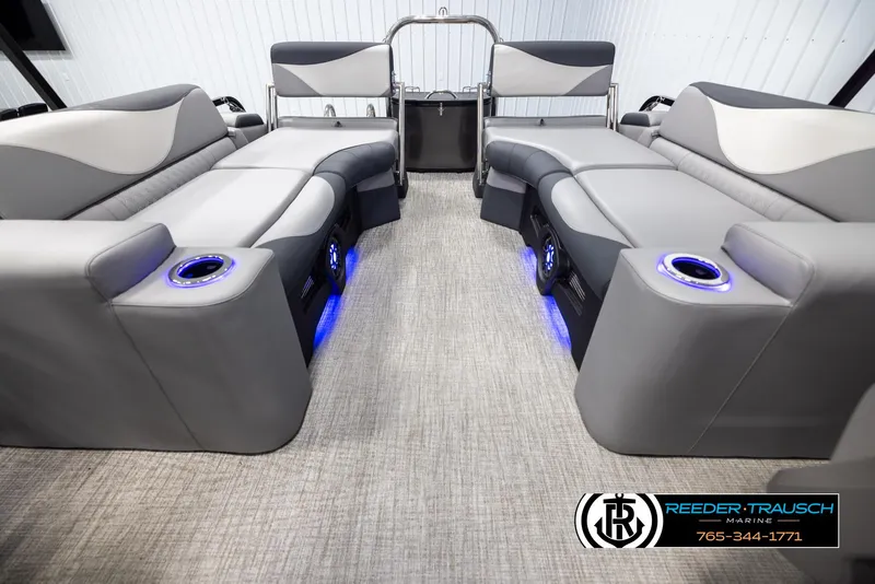 Slide: The Image of 2025 Avalon LSZ QLS boat interior with gray seating and blue LED cup holders. - 15