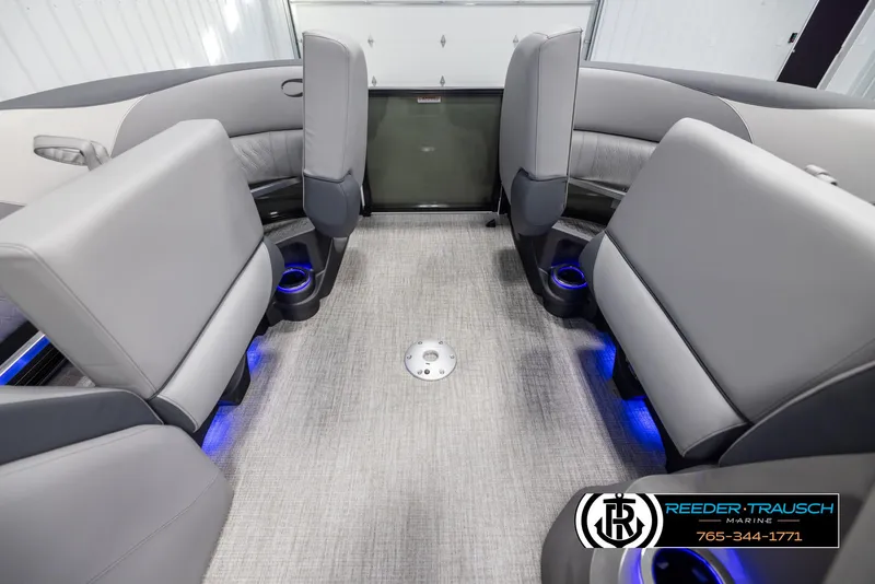 Slide: The Image of 2025 Avalon LSZ QLS boat interior with gray seating and blue LED lighting. - 19