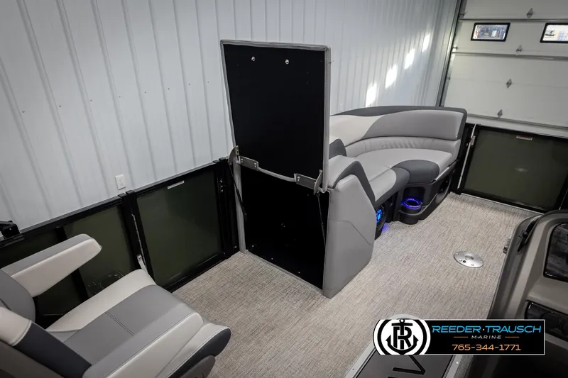 Slide: The Image of 2025 Avalon LSZ QLS boat interior with gray seating and carpeted flooring. - 22