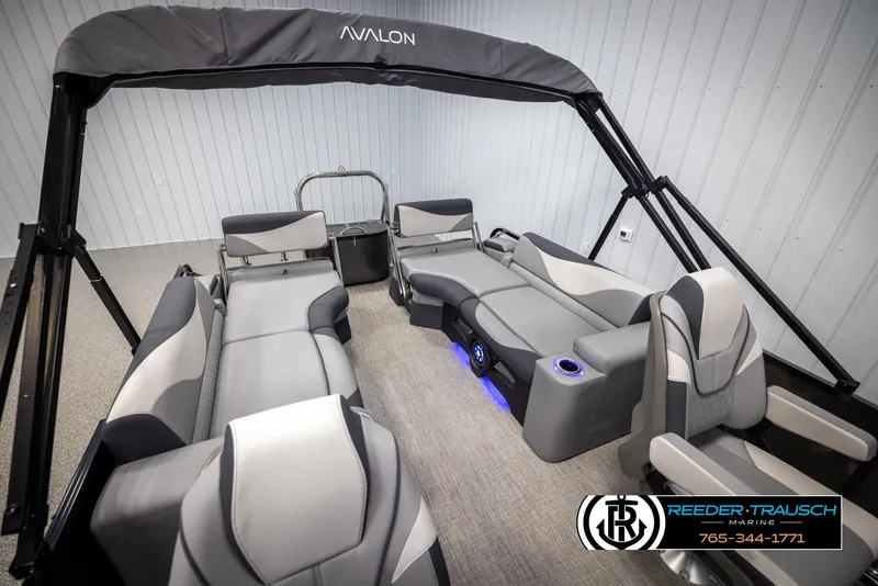Slide: The Image of 2025 Avalon LSZ QLS pontoon boat interior with modern seating and canopy. - 23