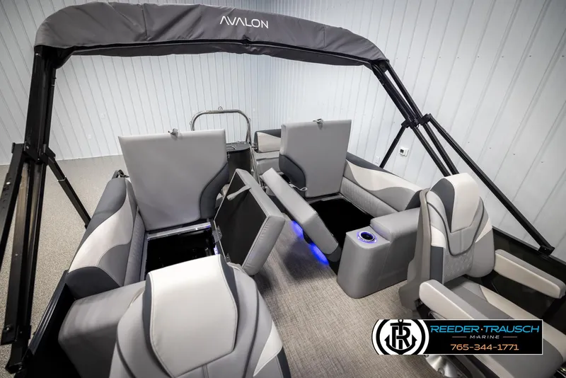 Slide: The Image of 2025 Avalon LSZ QLS pontoon boat interior with modern seating and cup holders. - 25