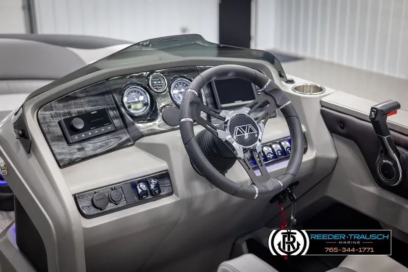 Slide: The Image of 2025 Avalon LSZ QLS boat dashboard with modern controls and steering wheel. - 27